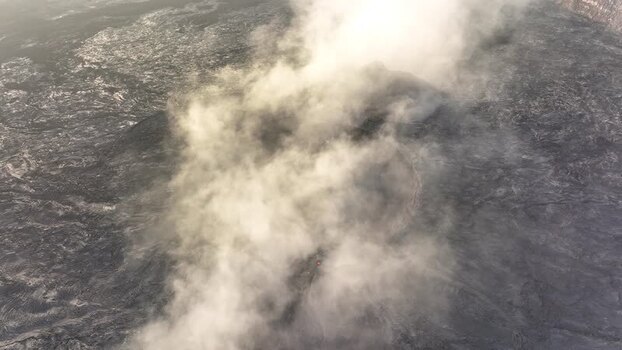 Aerial view of smoke rising from a volcanic crater Ethiopia. Aerial view of smoke rising from a volcanic crater Ethiopia.