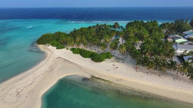 Aerial view of a tropical island with palm trees Maldives. Aerial view of a tropical island with palm trees Maldives.
