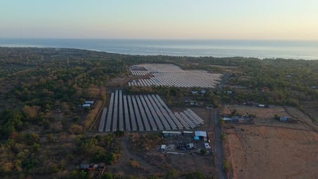 Aerial view of PLTS Bali Timur solar farm in Indonesia. Aerial view of PLTS Bali Timur solar farm in Indonesia.