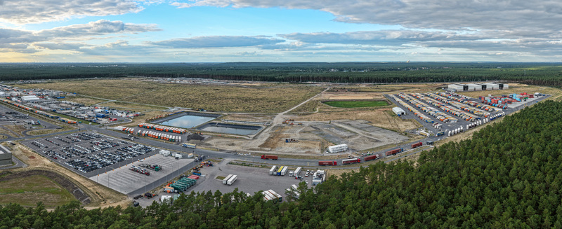 Grunheide Mark Brandenburg Germany 07 September 2026 Aerial view of Tesla Gigafactory Berlin Brandenburg with extensive vehicle parking logistics areas and surrounding forest landscape. Grunheide Mark Brandenburg Germany 07 September 2026 Aerial view of Tesla Gigafactory Berlin Brandenburg with extensive vehicle parking logistics areas and surrounding forest landscape.