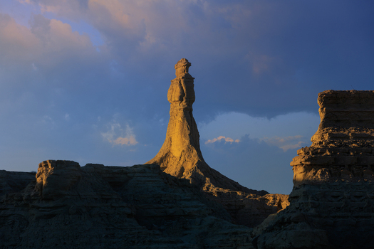 View of the Princess of Hope rock formation in the desert landscape along the Makran Coastal Highway illuminated by golden light Balochistan Pakistan.