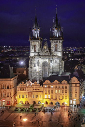 Aerial view of the illuminated Gothic spires of the Church of Our Lady before Tyn rising above the historic Old Town Square in Prague Prague Czechia. Aerial view of the illuminated Gothic spires of the Church of Our Lady before Tyn rising above the historic Old Town Square in Prague Prague Czechia.