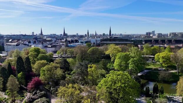 Aerial view of Planten un Blomen park and the city skyline in Hamburg Germany.