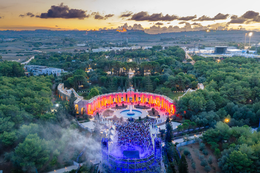 Attard Northern Region Malta 20 September 2026 Aerial view of Park Nazzjonali Ta Qali during an outdoor concert at sunset with a crowd before an illuminated stage. Attard Northern Region Malta 20 September 2026 Aerial view of Park Nazzjonali Ta Qali during an outdoor concert at sunset with a crowd before an illuminated stage.