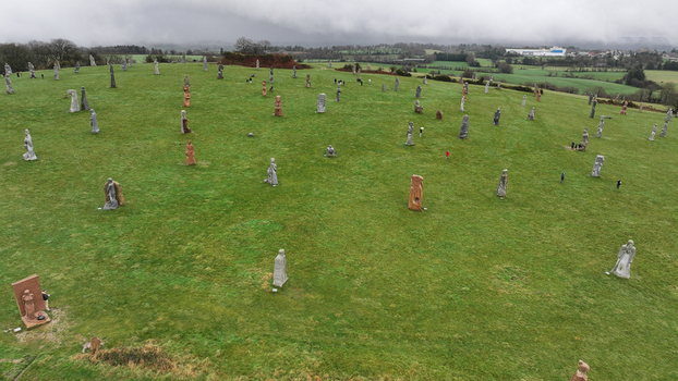Carnoet France 26 December 2023 Aerial view of the Valley of Saints featuring large granite sculptures scattered across a green hill under an overcast sky. Carnoet France 26 December 2023 Aerial view of the Valley of Saints featuring large granite sculptures scattered across a green hill under an overcast sky.