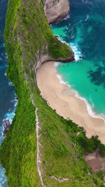 Aerial view of Kelingking Beach and turquoise waters in Indonesia. Aerial view of Kelingking Beach and turquoise waters in Indonesia.