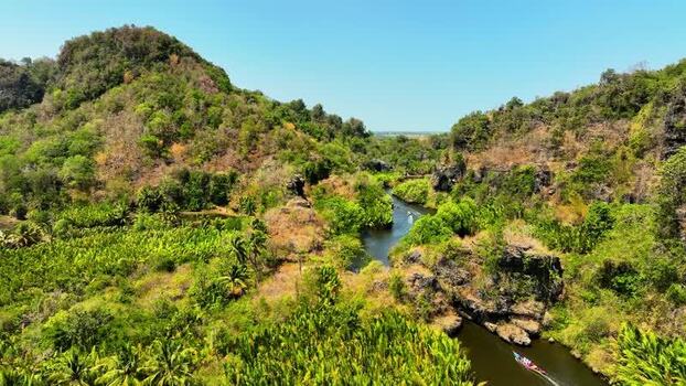 Aerial view of a river winding through karst hills in Maros Indonesia. Aerial view of a river winding through karst hills in Maros Indonesia.