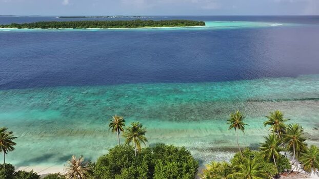 Aerial view of tropical islands with palm trees and coral reefs Maldives. Aerial view of tropical islands with palm trees and coral reefs Maldives.