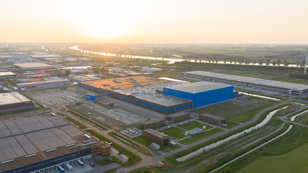 Waalwijk Noord Brabant Netherlands 09 May 2026 Aerial view of the Bol.com distribution center featuring large industrial warehouses with solar panels canals and green fields at sunset. Waalwijk Noord Brabant Netherlands 09 May 2026 Aerial view of the Bol.com distribution center featuring large industrial warehouses with solar panels canals and green fields at sunset.