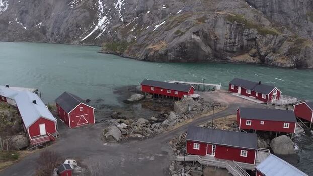Aerial view of red cabins in Lofoten Norway.