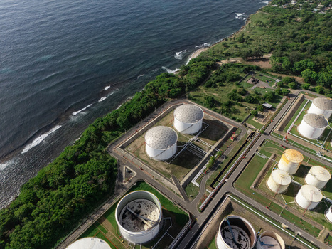 Aerial view of the industrial facility with large storage tanks located along the coastline in Bajos de Haina San Cristobal Province Dominican Republic.