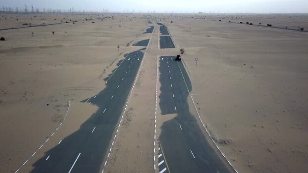 Aerial view of a desert road covered in sand United Arab Emirates.