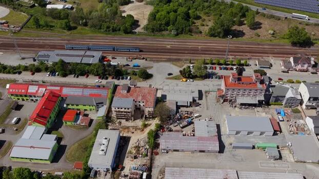 Aerial view of industrial buildings and railway in Czechia. Aerial view of industrial buildings and railway in Czechia.