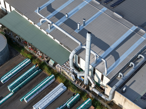 Kilsyth VIC Australia 22 September 2026 Aerial view of industrial factories with large ventilation pipes metal roofing and stacks of construction materials in the yard. Kilsyth VIC Australia 22 September 2026 Aerial view of industrial factories with large ventilation pipes metal roofing and stacks of construction materials in the yard.