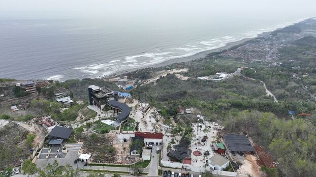 Kecamatan Purwosari Indonesia 23 November 2023 Aerial view of Obelix Sea View a coastal tourist destination with modern architecture pathways and gardens on a cliff overlooking the ocean. Kecamatan Purwosari Indonesia 23 November 2023 Aerial view of Obelix Sea View a coastal tourist destination with modern architecture pathways and gardens on a cliff overlooking the ocean.