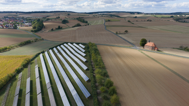 Aerial view of Wendelinuskapelle chapel situated near a solar farm in the rural landscape of Monchberg Bayern Germany. Aerial view of Wendelinuskapelle chapel situated near a solar farm in the rural landscape of Monchberg Bayern Germany.