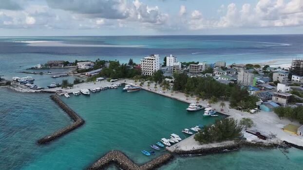 Aerial view of the harbor and tropical island of Gulhi Maldives. Aerial view of the harbor and tropical island of Gulhi Maldives.