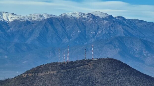 Aerial view of communication towers on a hill in Chile.