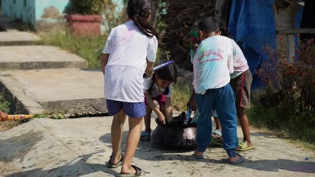 View of children playing with colors during Holi festival Nepal.