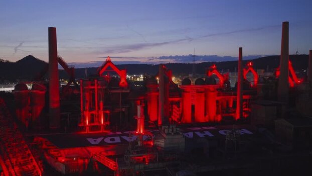 Aerial view of Volklingen Ironworks with red lights at dusk Germany. Aerial view of Volklingen Ironworks with red lights at dusk Germany.