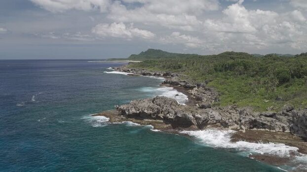 Aerial view of the rocky coastline of Siargao Island Philippines.