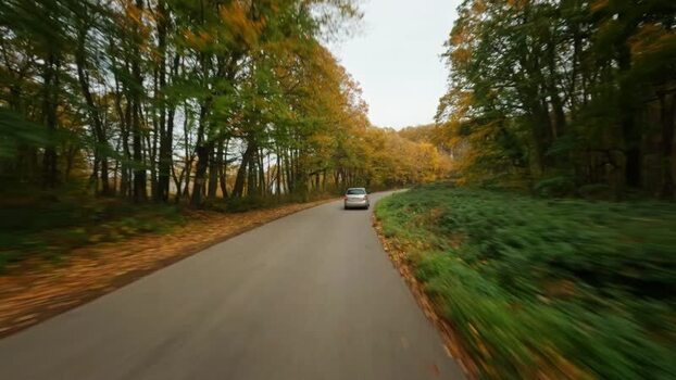 FPV aerial view of car on road in Fruska Gora SERBIA. FPV aerial view of car on road in Fruska Gora SERBIA.