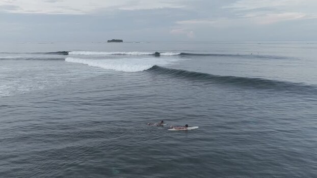 Aerial view of surfers waiting for waves at Siargao Philippines.