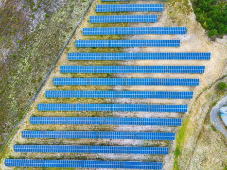 Aerial view of rows of solar panels in a solar farm capturing the geometric layout and sustainable energy infrastructure in Wilmington North Carolina United States. Aerial view of rows of solar panels in a solar farm capturing the geometric layout and sustainable energy infrastructure in Wilmington North Carolina United States.