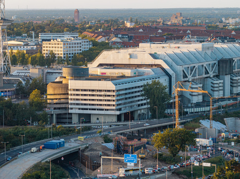 Aerial view of the Internationales Congress Centrum ICC featuring iconic brutalist architecture surrounding urban infrastructure and nearby roads in Berlin Berlin Germany. Aerial view of the Internationales Congress Centrum ICC featuring iconic brutalist architecture surrounding urban infrastructure and nearby roads in Berlin Berlin Germany.