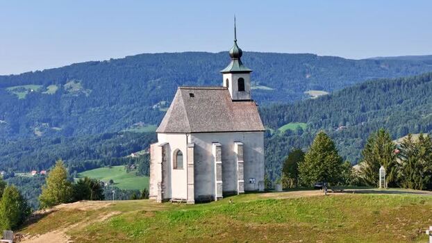 Aerial view of Wolfgangikirche on a hill in Schwanberg Austria. Aerial view of Wolfgangikirche on a hill in Schwanberg Austria.
