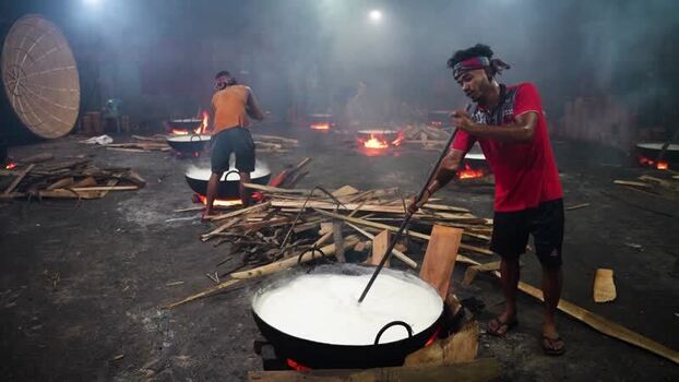 View of men cooking traditional sweets over open fires Bangladesh. View of men cooking traditional sweets over open fires Bangladesh.