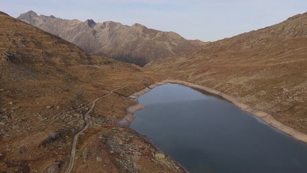 Aerial view of a mountain lake near Aletsch Glacier Switzerland.