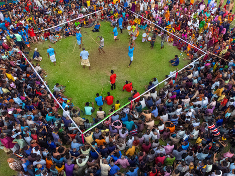 Nilphamari Bangladesh 01 May 2026 Aerial view of a traditional Lathi Khela stick fighting performance with a large crowd of spectators gathered around a grassy arena. Nilphamari Bangladesh 01 May 2026 Aerial view of a traditional Lathi Khela stick fighting performance with a large crowd of spectators gathered around a grassy arena.