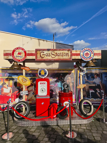 Hanover Lower Saxony Germany 06 April 2026 View of a vintage style gas station display featuring a red fuel pump retro signage and classic automotive memorabilia.