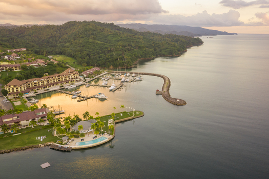 Aerial view of The Bannister yacht club with a small harbour at sunset The Bannister Dominican Republic.
