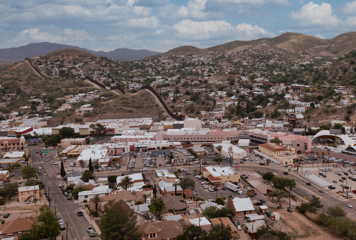 Aerial view of the international border wall separating the city of Nogales Arizona United States.