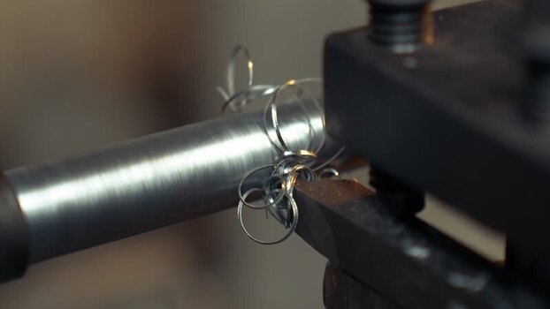 View of a metal lathe machine cutting a steel rod Bangladesh. View of a metal lathe machine cutting a steel rod Bangladesh.