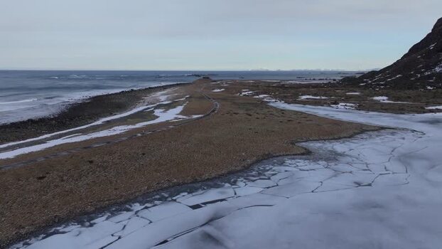 Aerial view of frozen Lofoten coastline Norway.