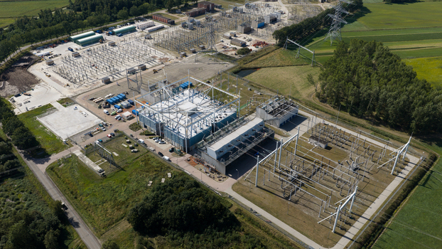 Aerial view of Hoogspanningsstation Meeden a large electrical substation with high voltage equipment and power lines set within a rural landscape in Meeden Groningen Netherlands.