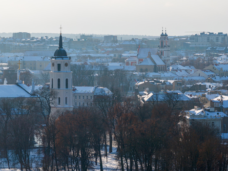 Aerial view of the Vilnius Cathedral Bell Tower and snow covered rooftops in the historic old town of Vilnius Vilnius County Lithuania.