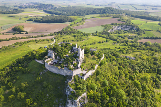 Aerial view of Falkenstein Castle ruins stand majestically atop a verdant hill a testament to history amidst nature s embrace Falkenstein Lower Austria Austria. Aerial view of Falkenstein Castle ruins stand majestically atop a verdant hill a testament to history amidst nature s embrace Falkenstein Lower Austria Austria.