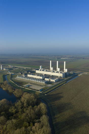 Aerial view of the Nitrogen plant with its tall chimneys and industrial structures surrounded by green agricultural fields under a clear blue sky in Zuidbroek Groningen Netherlands. Aerial view of the Nitrogen plant with its tall chimneys and industrial structures surrounded by green agricultural fields under a clear blue sky in Zuidbroek Groningen Netherlands.