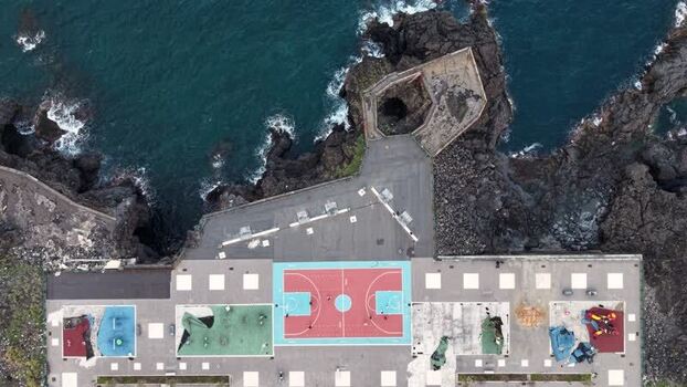 Aerial view of a basketball court on volcanic rocks Italy. Aerial view of a basketball court on volcanic rocks Italy.