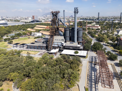 Aerial view of the historic Fundidora Park featuring the iconic blast furnace industrial architecture lush green trees and walking paths in Monterrey Nuevo Leon Mexico. Aerial view of the historic Fundidora Park featuring the iconic blast furnace industrial architecture lush green trees and walking paths in Monterrey Nuevo Leon Mexico.