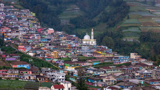 Aerial view of the colorful houses and terraced fields of Nepal Van Java village on the slopes of Mount Sumbing in Kecamatan Kaliangkrik Jawa Tengah Indonesia.