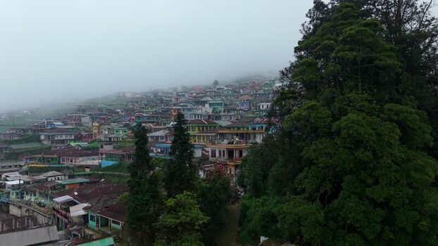 Aerial view of Nepal Van Java village on a misty hillside Indonesia.