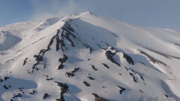 Aerial view of the snow covered peak of Mount Etna Italy. Aerial view of the snow covered peak of Mount Etna Italy.