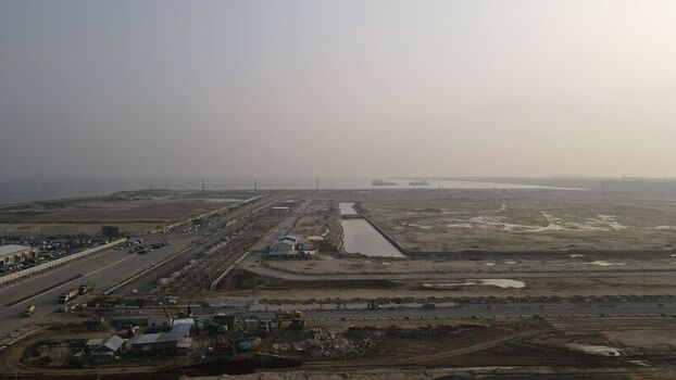 Aerial view of the Pantai Indah Kapuk 2 development area featuring coastal construction roads and canals in Kecamatan Penjaringan Banten Indonesia. Aerial view of the Pantai Indah Kapuk 2 development area featuring coastal construction roads and canals in Kecamatan Penjaringan Banten Indonesia.