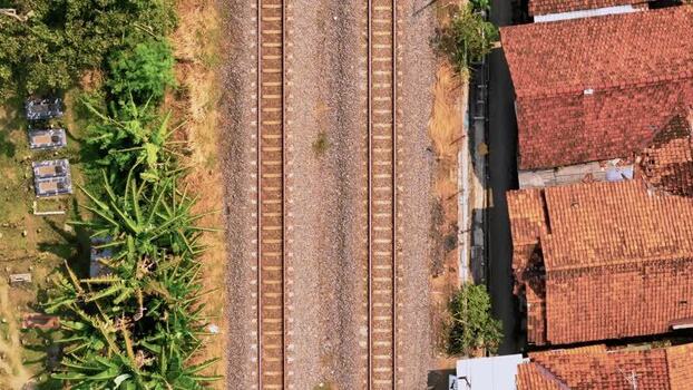 Aerial view of railway tracks and rooftops in Pekalongan Indonesia. Aerial view of railway tracks and rooftops in Pekalongan Indonesia.