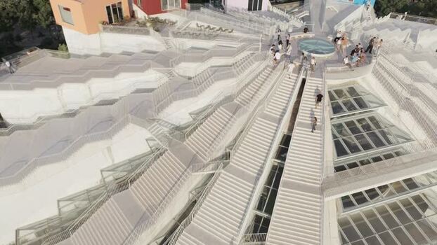 Aerial view of the Pyramid of Tirana with people on stairs Albania.